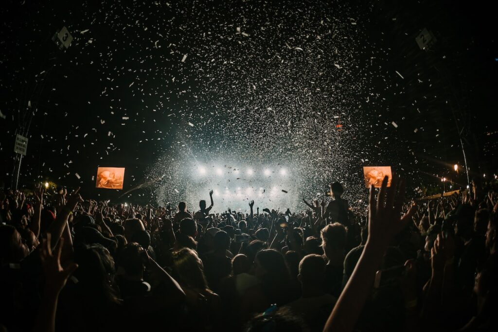 people gathering on concert field