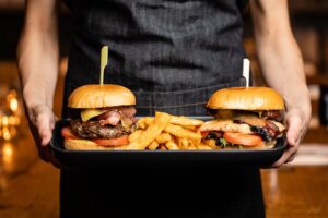 hamburgers and fries on tray